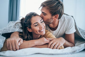 couple relaxing in bedroom