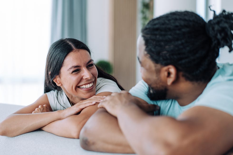 couple relaxing in bedroom