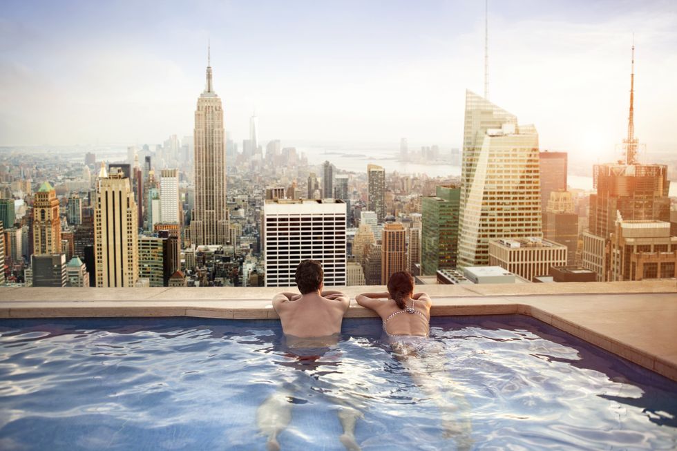 couple relaxing on hotel rooftop