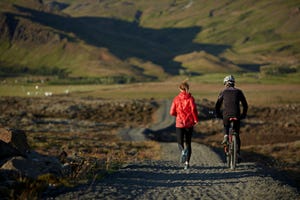 couple running and biking together