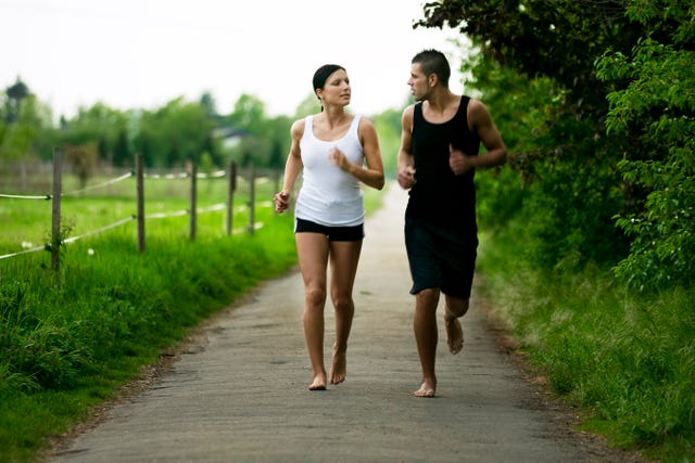 couple running barefoot