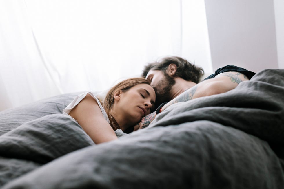 couple sleeping in bed together