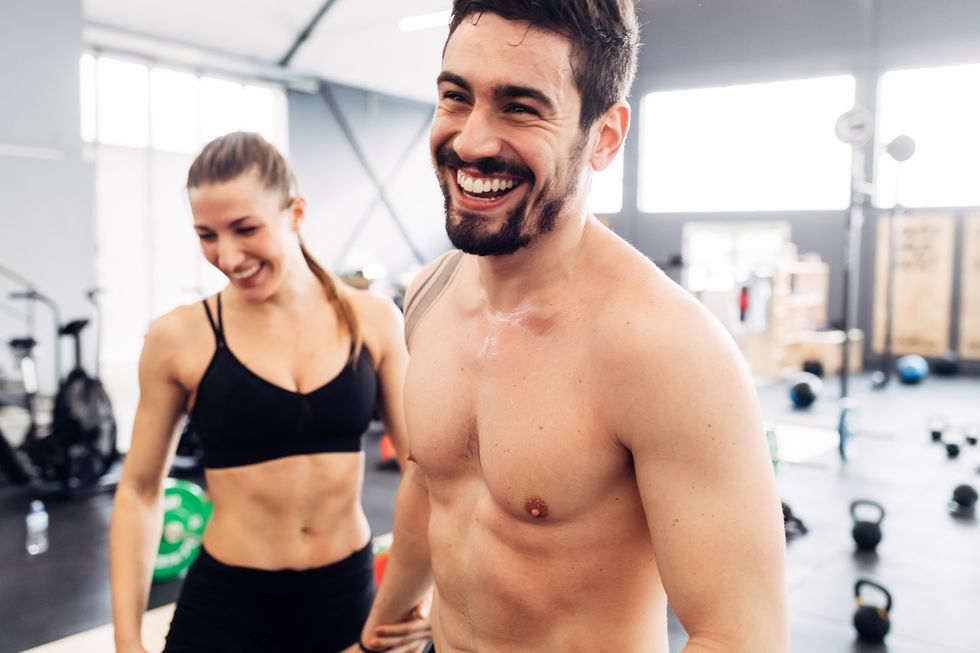 Couple smiling in gym