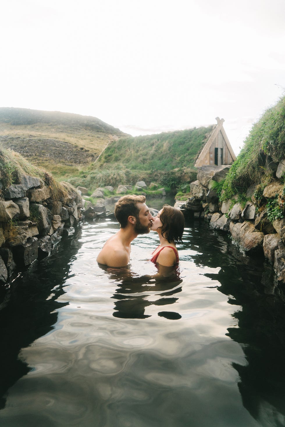 couple taking bath in hot spring