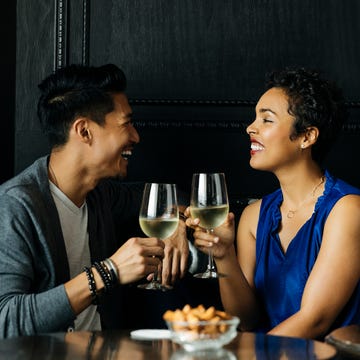 Couple toasting wine glasses at restuarant couple toasting wine glasses at restuarant