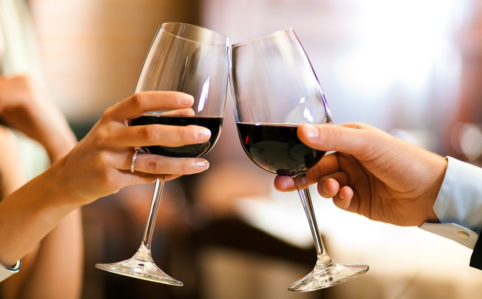 couple toasting wine glasses