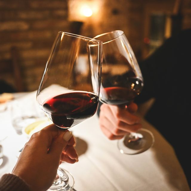 couple toasting wineglasses in a luxury restaurant
