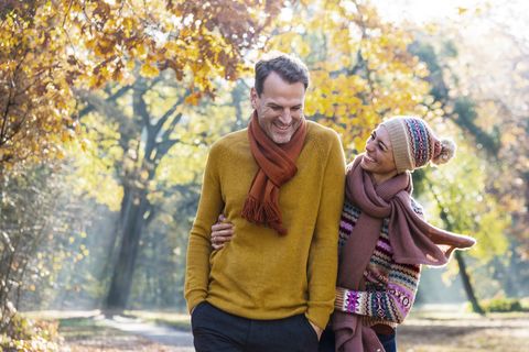 couple walking in autumnal park