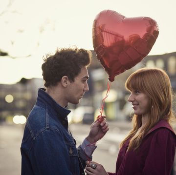 couple with heart shaped balloon