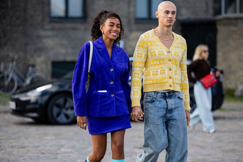 couple wears blue velvet blazer skirt black boots and a news photo