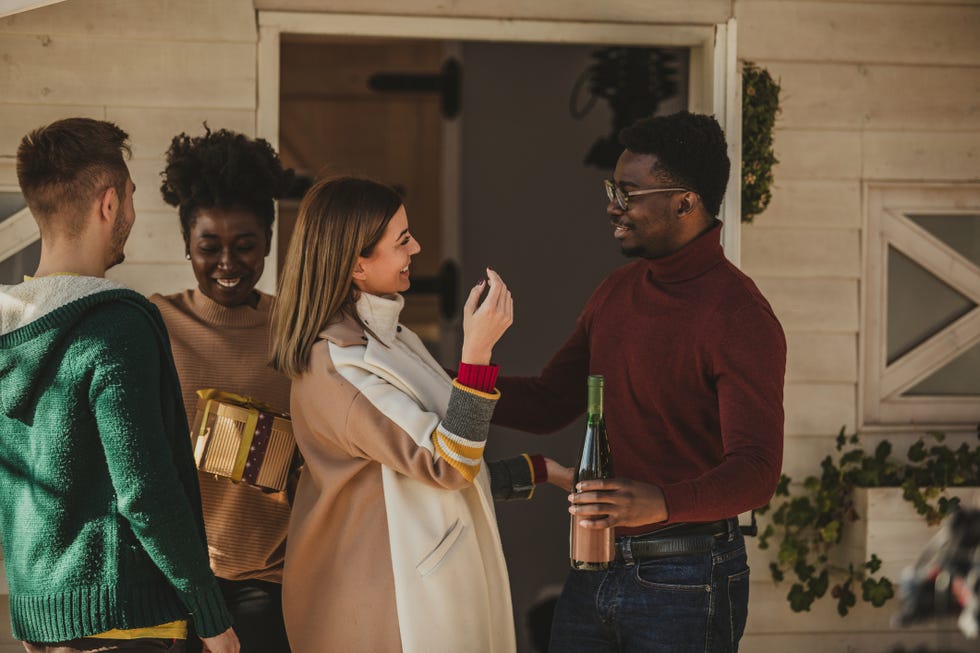 couple welcoming their friends in their home