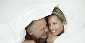 couple wrapped in a duvet