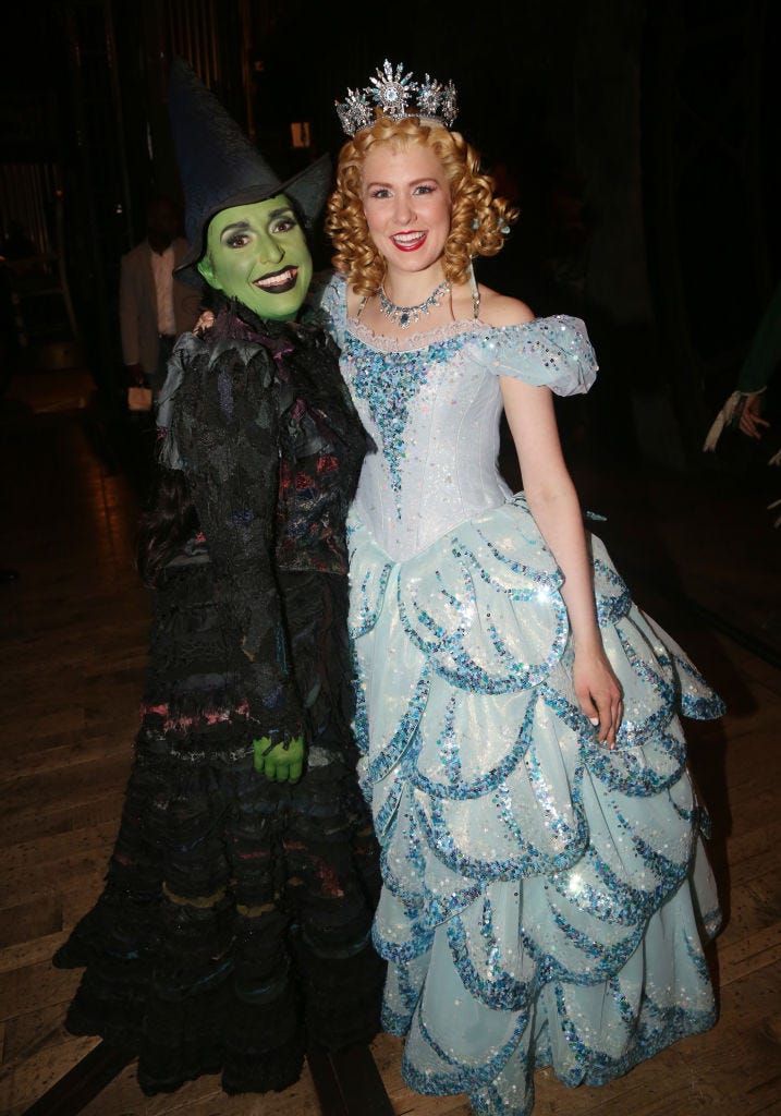 ginna claire mason as glinda and jessica vosk as elphaba pose backstage at the hit musical wicked on broadway