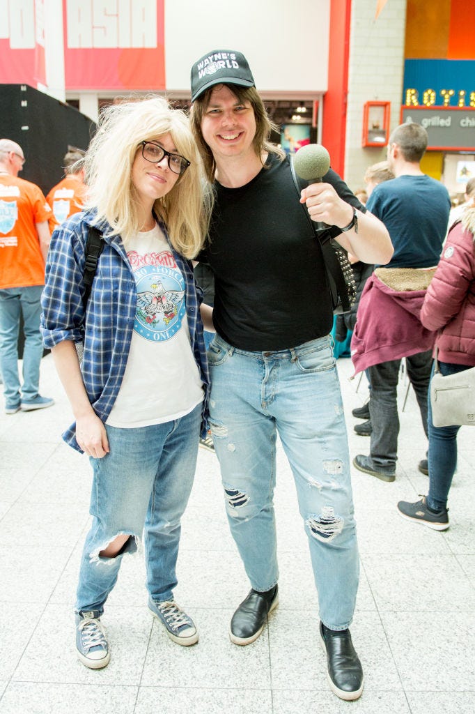 cosplayers in character as mike myers as wayne campbell and dana carvey as garth algar from the waynes world films