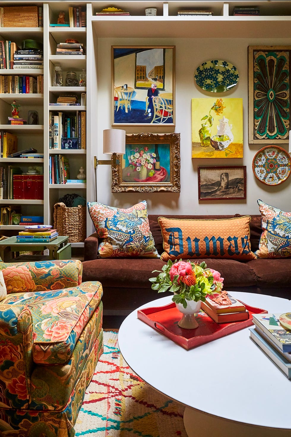 a living room with a bookcase and a couch