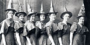 women dressed for halloween as a witches coven