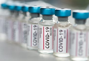 covid 19 coronavirus vaccine vials in a row macro close up