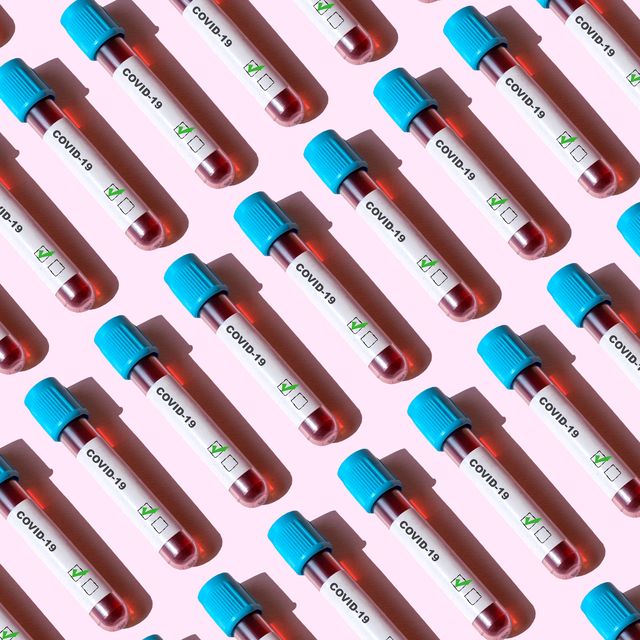 covid 19 positive test tubes on the pink background