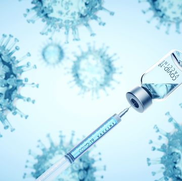 covid 19 vaccine filling syringe