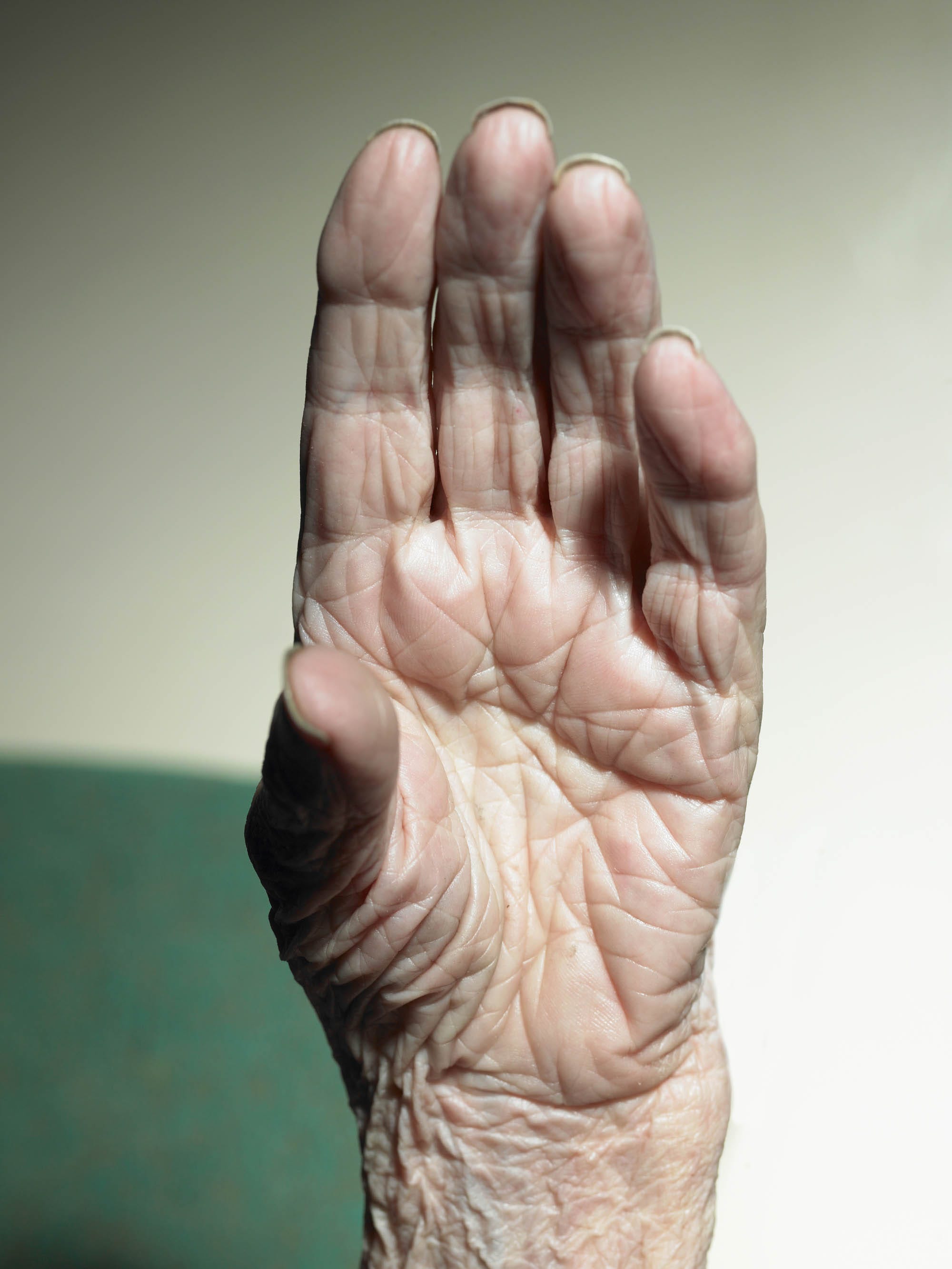 Close up of a senior woman's wrinkled hand