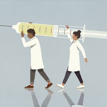 doctors carrying large syringe