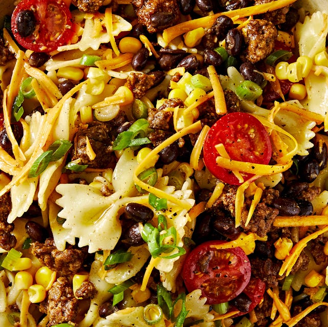 cowboy pasta salad with bowtie pasta, tomatoes, ground beef, cheese, corn, and black beans