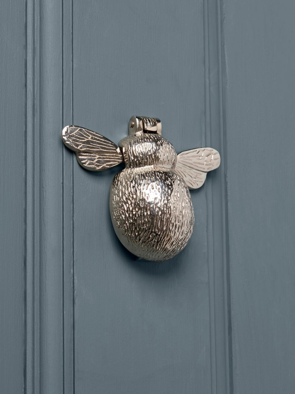 a door knocker shaped like a bee
