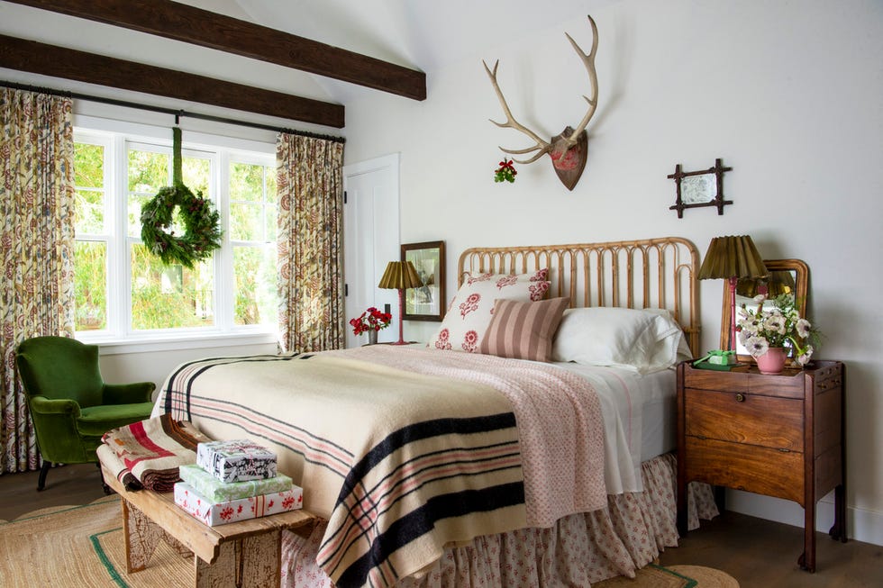 a bedroom in a log cabin with christmas decor