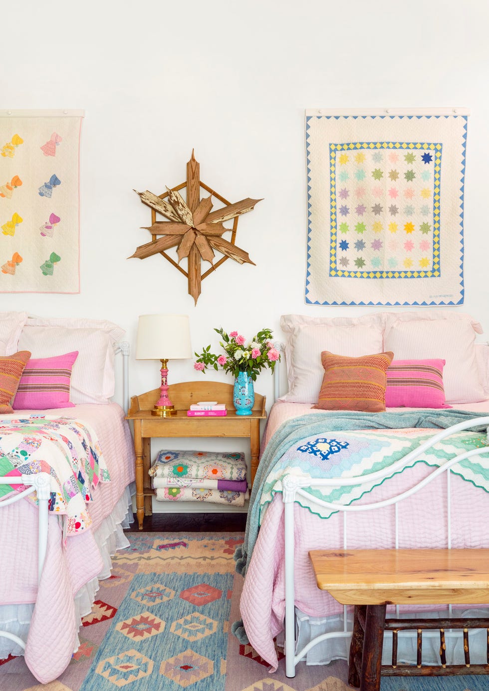 childs bedroom with pink quilts