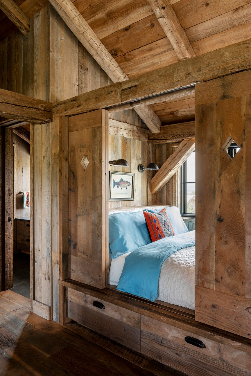a sleeping nook made of wood in dutch barn in idaho