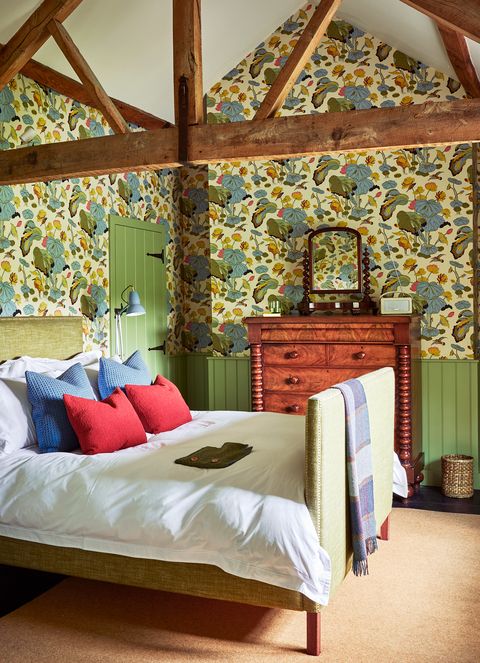 cozy bedroom with floral wallpaper