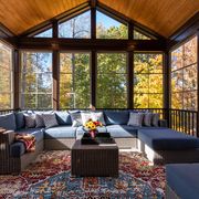 fall porch ideas cozy furnished porch enclosure in autumn season with wicker furniture and colorful distressed area rug