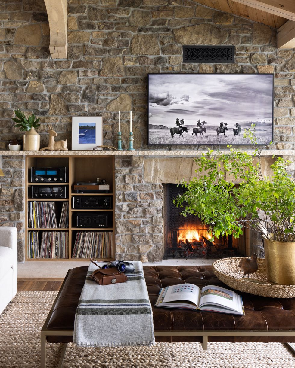 a living room with stone walls in lake pulaski, minnesota