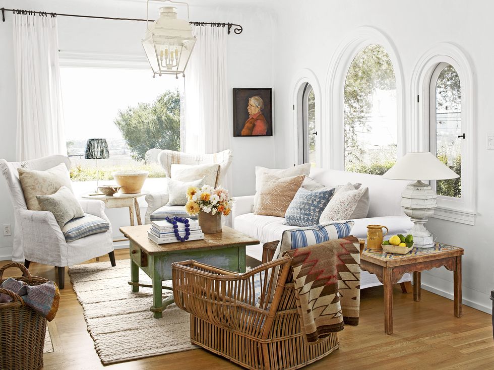 a white cozy living room with layered textiles