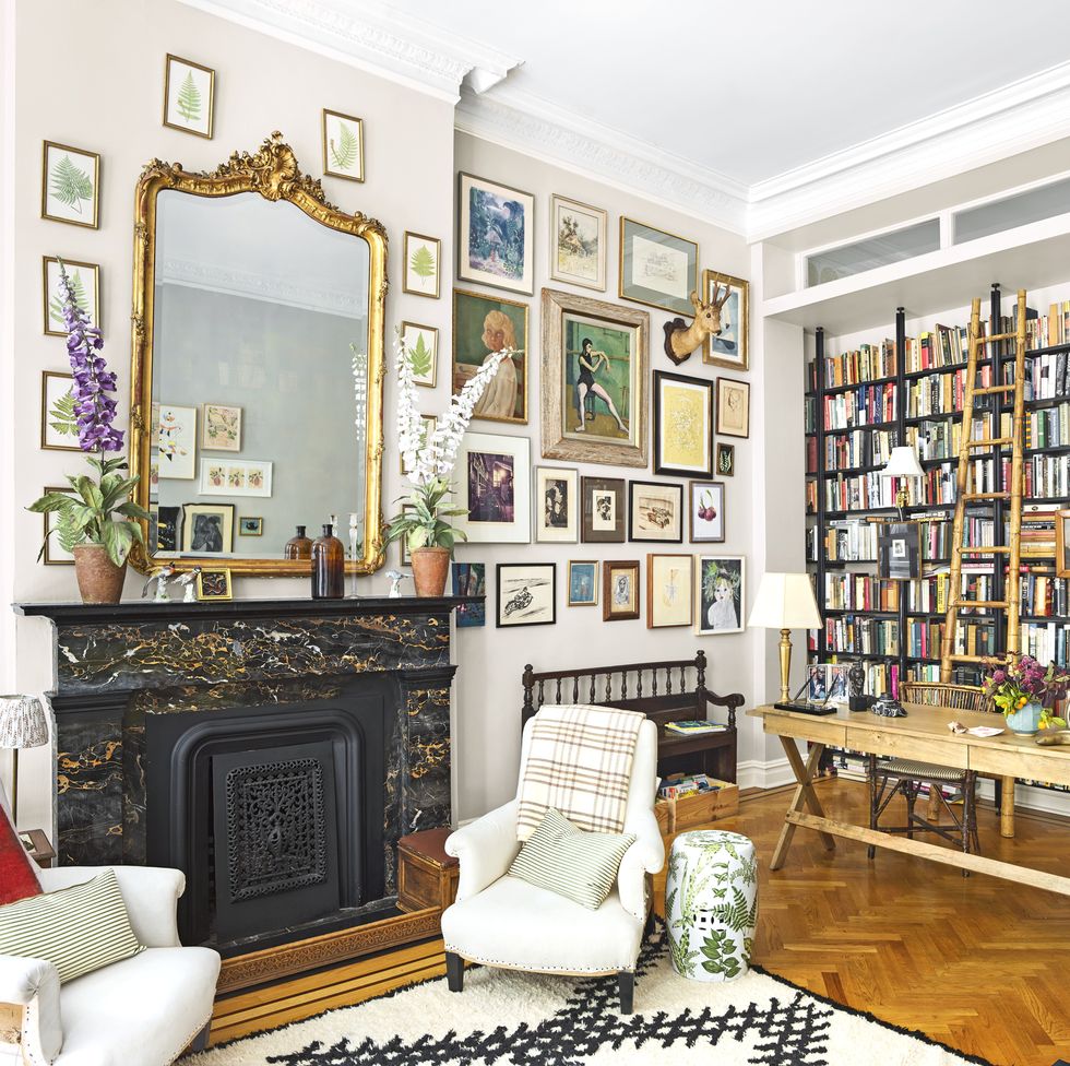 salon inspired living room with books and a gallery wall
