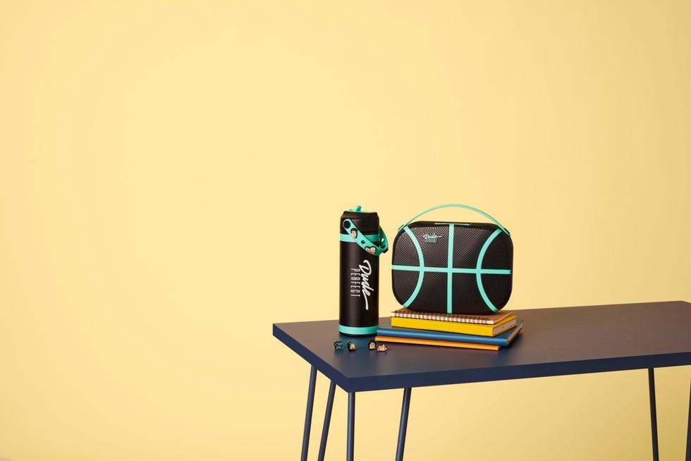 a trendy assortment of school and sportsthemed items on a table