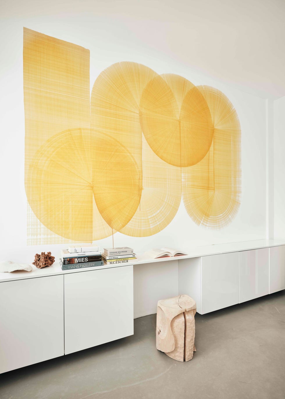 a study space with a bright yellow artwork