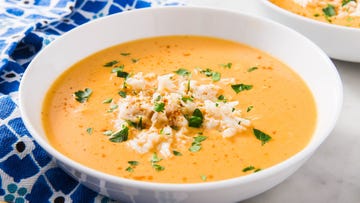 crab bisque topped with crab and herbs