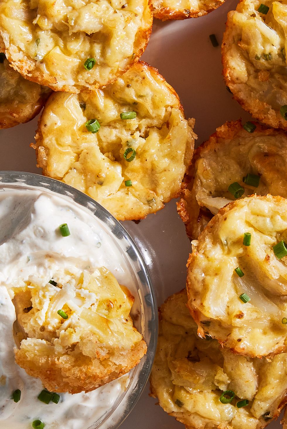 crab cake bites dipped in a sour cream and chive dipping sauce