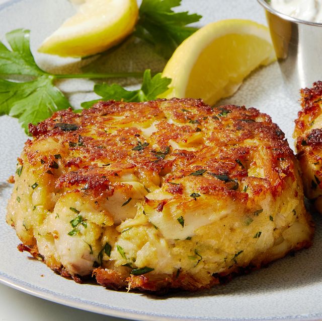 flaky crab cakes stacked and served with tartar sauce