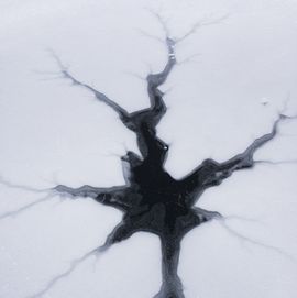 cracked ice on frozen lake