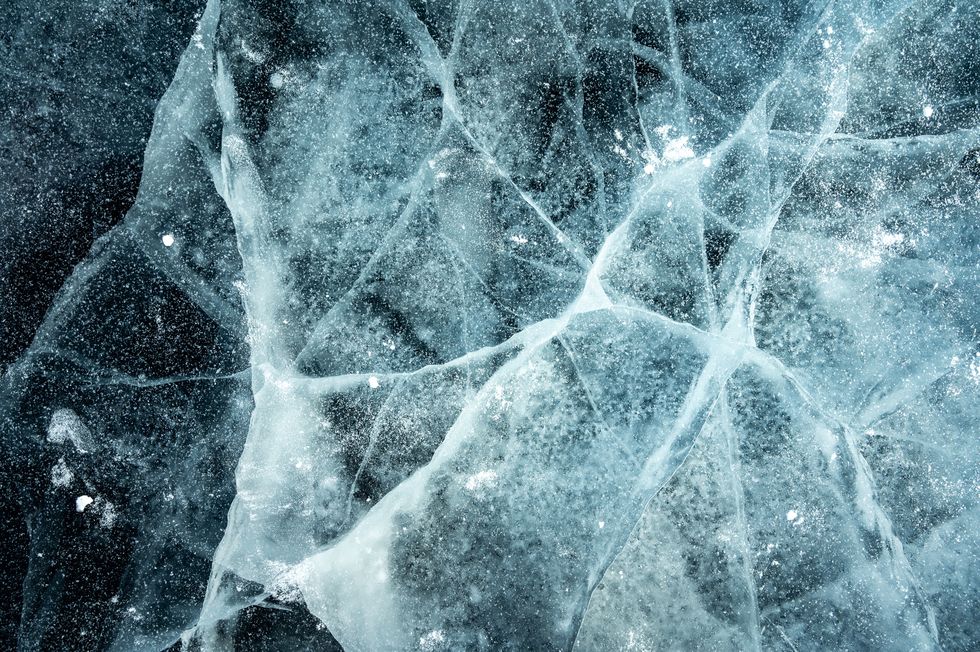 cracks surface of the frozen lake of baikal lake in winter season