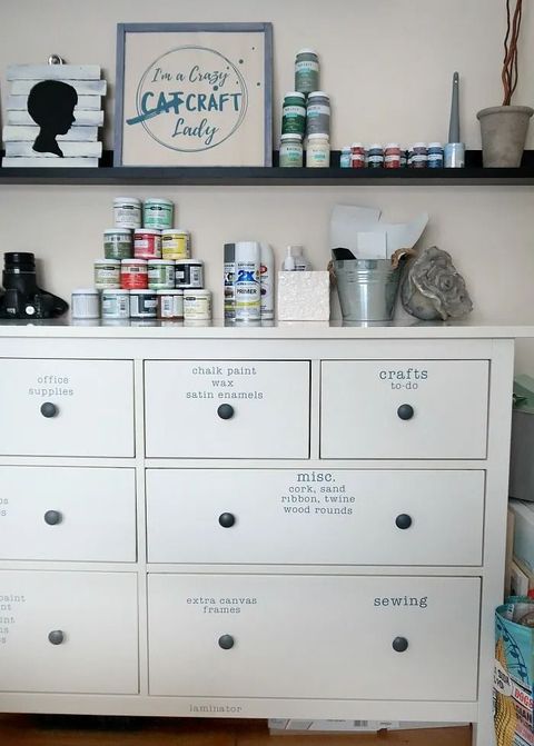 craft room idea using labeled cabinets