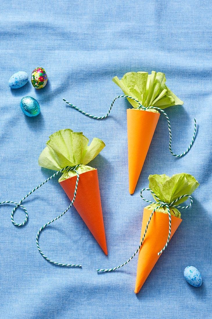 crafts for kids carrot treat cones with green tissue paper inside