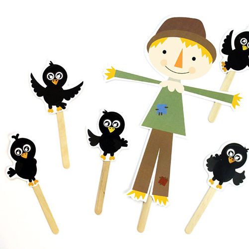 scarecrow puppet made with popsicle stick with 5 crow puppets