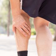 Cramp in leg while exercising. Sports injury concept