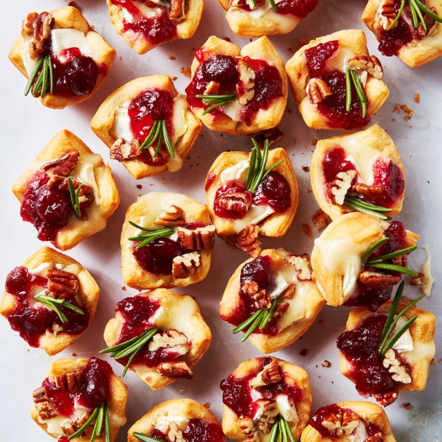 crescent dough bites filled with brie and cranberry sauce