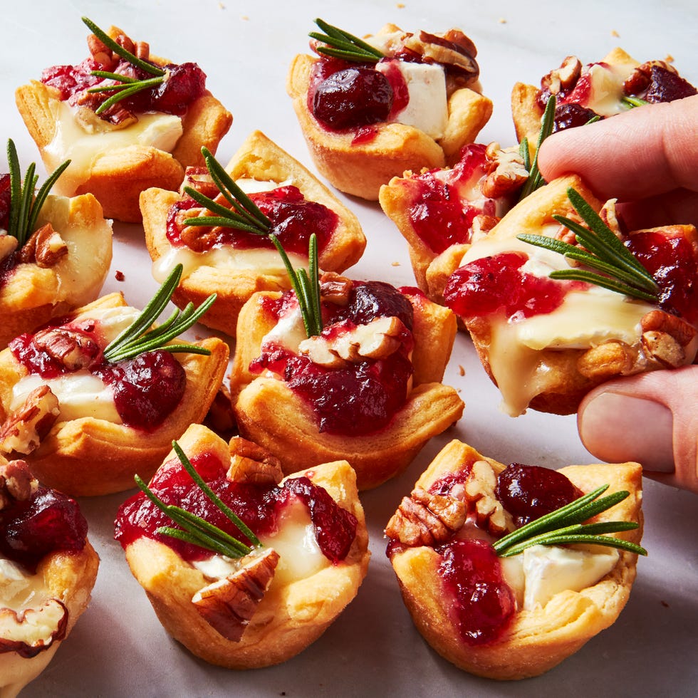 crescent dough bites filled with brie and cranberry sauce