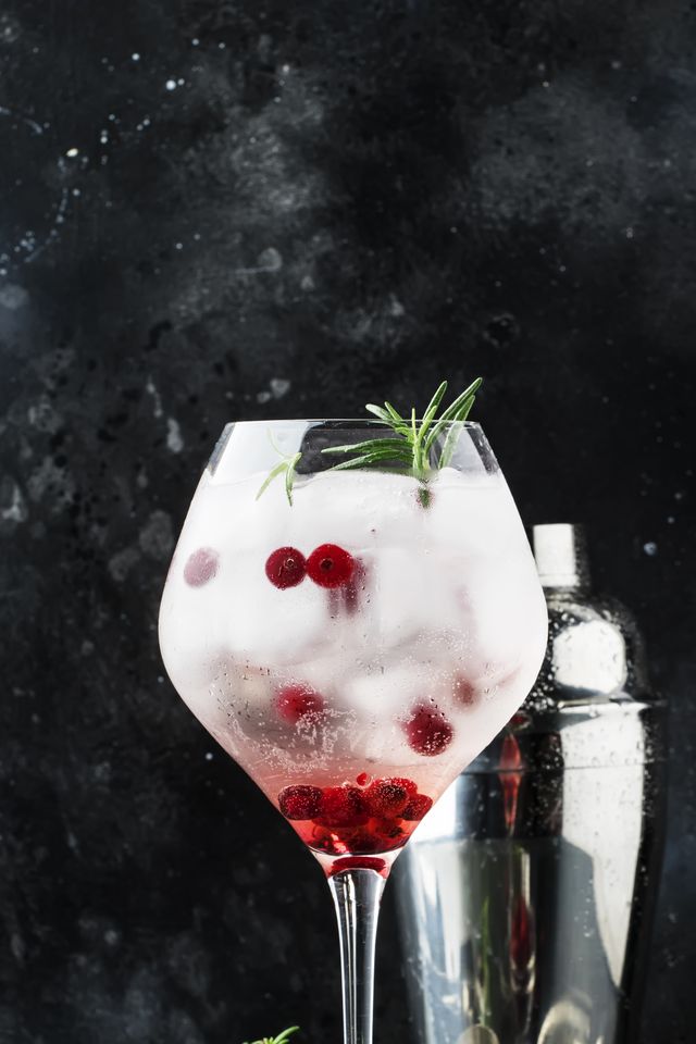 Cranberry Cocktail With Ice, Fresh Rosemary And Red Berries In B