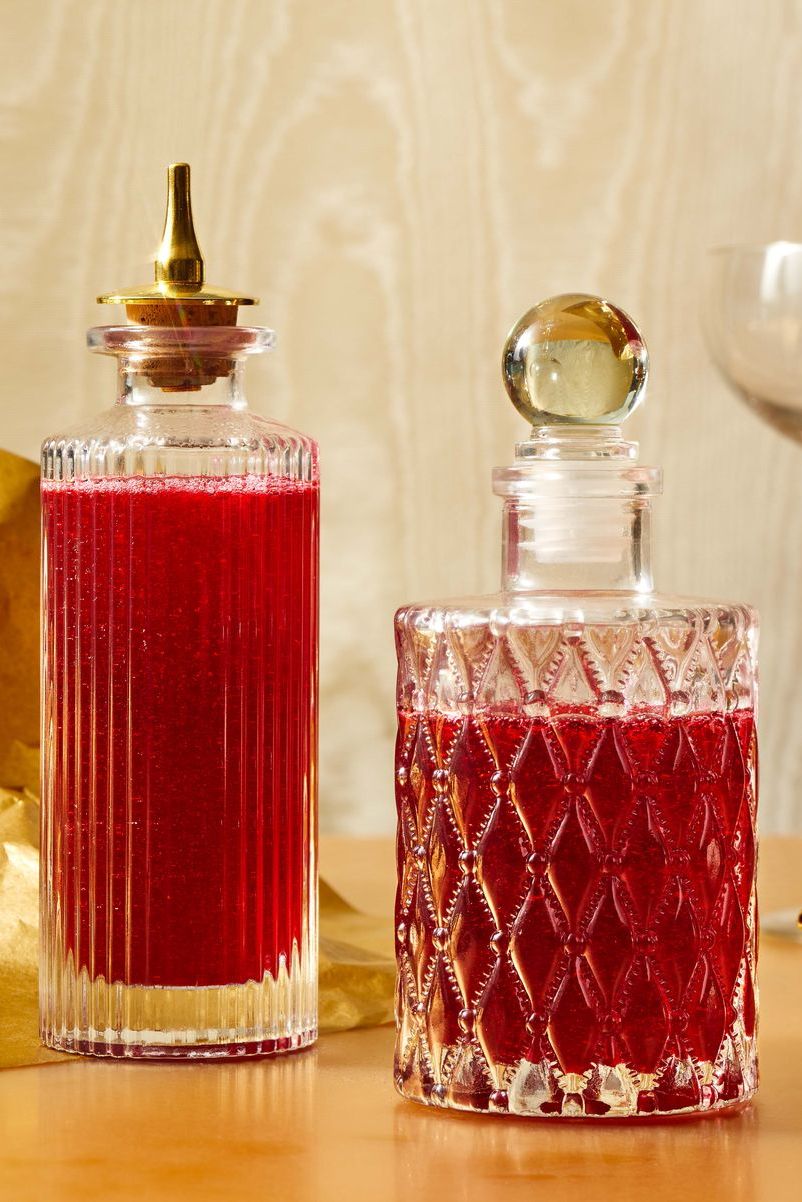 cranberry simple syrup in a glass decanter